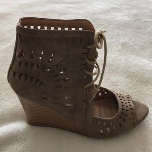 Report brand nude sandals.